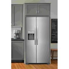 a stainless steel refrigerator with ice and water dispenser on the door in a kitchen