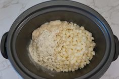 the food is being prepared in the slow cooker