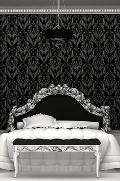 a black and white photo of a fancy bed