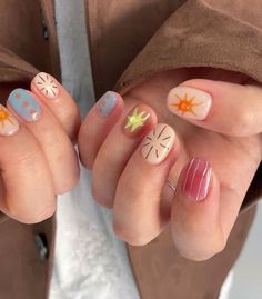 These nails feature a playful summer design with soft pastel blue, peach, and nude tones. The intricate sun and abstract patterns evoke the carefree spirit of sunny days.  🌸Click on the image to shop our Korean Gel Nail Polish Collection  🌸Credit: sy__nail_ on Instagram 🌸summer nail designs, pastel nails, sun nail art, Korean gel polish, abstract nail design, trendy summer nails, cute nail art, bright nail colors, summer manicure, Instagram nails Sun Nails, Nails Fun, Instagram Nails, Pastel Nails