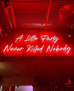 a red neon sign that says a little party never ripped nobody on it's side