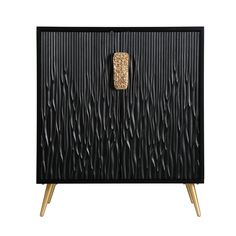 a black cabinet with gold handles and an abstract design on the front, against a white background