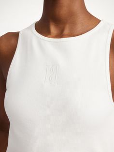 You will be sure to reach for the Amanias tank top as the temperature rises. The minimalist shape and stretchy fabrication make the design easy to pair with skirts and shorts alike. Its key feature? The embroidered monogram on its front. Slightly Stretchable Sleeveless Summer Crop Top, Embroidered Monogram, The Minimalist, Tops Online, Knitwear Tops, Short Shirts, Online Tops, Dress Trousers, Beauty Bag