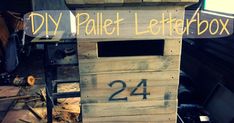 a pallet letterbox with the number 24 written on it