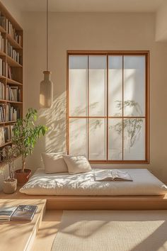 This #Japandi #reading #nook in the corner of the #room blends effortless #style with serene #simplicity, creating a #calming #aesthetic. Surrounded by #shelves brimming with books, a minimalist seating invites #relaxation and #focus. The #soft, #neutral tones and #natural materials make this #nook a peaceful retreat for both #reading and #reflection. Japandi Reading Nook, Reading Nook Aesthetic, Japanese Style Bedroom, Calming Aesthetic, Reading Corners, Japandi Interior, Style Bedroom