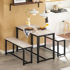 a kitchen table with two benches next to it and an open shelf above the table