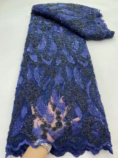 a woman's hand is shown with a blue lace