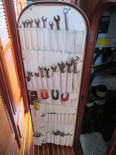 there are many tools hanging on the wall