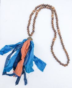 Recycled saris share their stories when worn in this beautiful tassel necklace. Give new life to beautiful sari fabrics in rich hues. Silk Tassel Necklace, Tassel Necklace Boho, Bones Bracelet, Sari Fabric, Hammered Gold, Beaded Hoops, Red And Gold, Blue Beads, Bracelet Stack