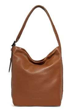 A whipstitched, woven-leather shoulder strap that wraps around the sides gives this slouchy suede bag a vintage-inspired look. The everyday style is equipped with plenty of pockets for easy organization. Magnetic-snap closure Adjustable shoulder strap Exterior slip pocket Interior zip, wall and smartphone pockets Protective metal feet Logo-print lining Leather Imported Fall Leather Hobo Bag With Braided Handles, Brown Hobo Bag With Braided Handles For Evening, Everyday Suede Bucket Bag With Adjustable Strap, Chic Suede Shoulder Bag With Metal Hardware, Luxury Suede Shoulder Bag With Metal Hardware, Everyday Suede Bags With Silver-tone Hardware, Feet Logo, All For Love, Cognac Bucket Bag With Adjustable Strap, Pouch Shape