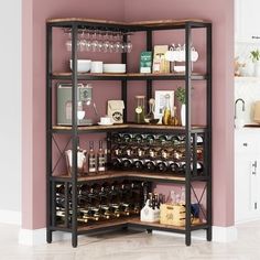 a wine rack with many bottles and glasses on it