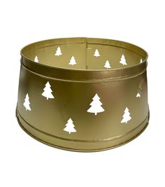 a gold tin can with white trees on it