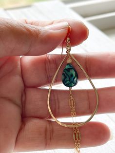 "The Alohi Earrings are made with 14 kt gold fill teardrop shaped hoops, ear wire and sparkly gold fill chain accents. The focal in the middle is a vibrant blue Paua shell teardrop and gold fill bead. These earrings hang about 3\" down from the bottom of the ear wire with the chain and 1 1/8\" wide." Paua Shell, Vibrant Blue, Gold Filled Chain, Ear Wire, Turquoise Necklace, Gold Filled, Dangle Drop Earrings, Shells, Pendant Necklace