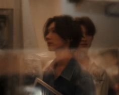 blurry photograph of two people standing next to each other