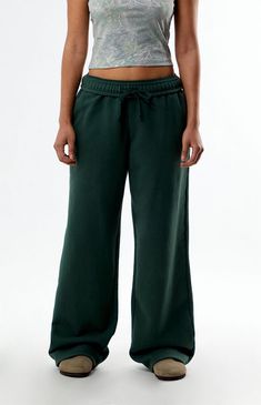 The Washed Baggy Sweatpants from PacSun combine comfort with a laid-back style. Featuring a high-rise fit, soft fleece lining, and snow wash fabric, these sweatpants come with an interior drawstring waistband, side hand pockets, and wide leg openings, all in a relaxed baggy fit for effortless cool.Solid color sweatpants32" inseam11.25" rise21" leg openingHigh-riseSoft fleece liningSnow wash fabricSingle back pocketInterior drawstring waistbandSide hand pocketsWide leg openingsBaggy fit78% cotton, 22% polyesterMachine washableModel is wearing a size smallModel measurements: 5’11” height, 35” bust, 26” waist, 38” hipsMeasurements are taken from a size small PacSun Womens Washed Baggy Sweatpants - Green size Small Pacsun Outfits, Green Sweatpants, Baggy Sweatpants, Wide Leg Sweatpants, Cute Preppy Outfits, Laid Back Style, Womens Loungewear, Clothes Collection, Preppy Outfits