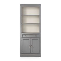 a gray bookcase with two doors and drawers on the bottom, one door open