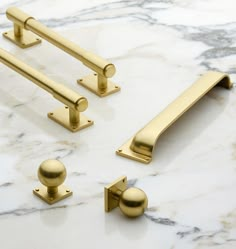 brass handles and pulls on a marble countertop