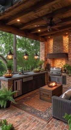 an outdoor kitchen and dining area with brick walls, wood ceilinging, and potted plants