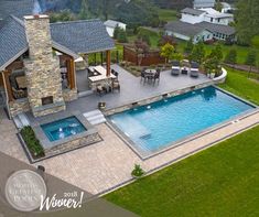 an aerial view of a backyard with a pool and hot tub in the foreground