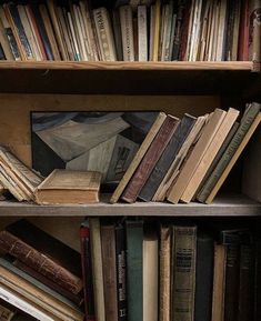 an old bookshelf filled with lots of different types of books on top of each other