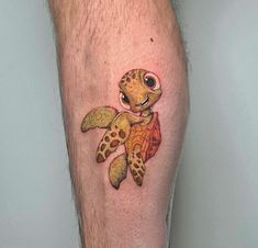 a man's leg with a turtle tattoo on it