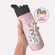 a hand holding a pink water bottle with the words i'm a sticker on it