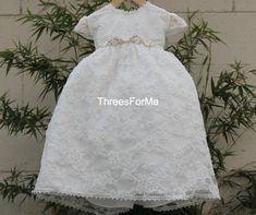 Our Erica Baptism dress is not only beautiful it's also our most popular. Our  baptism dress is completely laced front and back and there are pearls sewn in between the flower design on the lace.  Ankle length which means you little ones toes will show. Lace cap sleeves perfect for summer weather, fully lined for extra comfort.  Build in tulle net  to add fullness.  Beautiful matching lace bonnet.  Middle flower decorations are all handmade and removable.CareDry clean only Refunds/ ExchangeIf yo Fitted First Communion Dress With Lace Trim For Pageants, First Communion Lace Dress With Lace Trim For Pageant, First Communion Lace Dress For Pageant, Lace First Communion Dress For Pageant, Lace First Communion Dress With Lace Trim For Pageant, Fitted Short Sleeve Baptism Dress For Pageants, Fitted Short Sleeve Baptism Dress For Pageant, Fitted Lace First Communion Dress, Fitted Lace Dress For First Communion