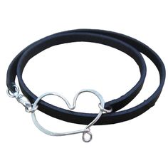 A chunky leather double wrap bracelet with a handcrafted heart centerpiece is ruggedly dainty. The leather is 5mm wide and 2mm thick and the sterling silver centerpiece measures about 1-1/4 inches (3 cm) wide. All held together with a sterling silver lobster clasp. Leather is available in Black, Brown, White and Dark Red-Brown.Please measure your wrist to find the best size for you. Add length based on whether you prefer a looser or tighter fit and select the size that best corresponds to your p Adjustable Heart Bracelet With Sterling Silver Clasp, Heart-shaped Leather Jewelry For Gifts, Adjustable Heart Shaped Jewelry With Sterling Silver Clasp, Heart-shaped Leather Jewelry Gift, Adjustable Open Heart Everyday Bracelet, Dark Red Brown, Silver Centerpiece, Double Wrap Bracelet, Handmade Jewelry Designs