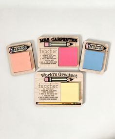 three erasers with different colors and writing on them