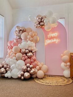 balloons are arranged in the shape of an arch