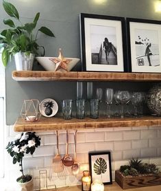 a shelf with pictures and other items on it