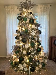 a christmas tree decorated with ornaments and lights