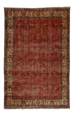 an antique rug with red and gold colors