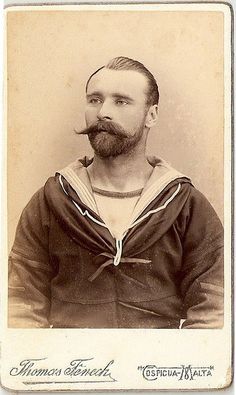 an old - fashioned photo of a man with a moustache on his face