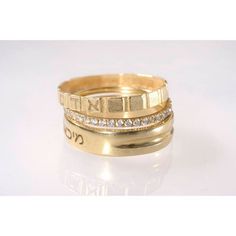 two gold wedding bands with diamonds on each band, set in 18k yellow gold