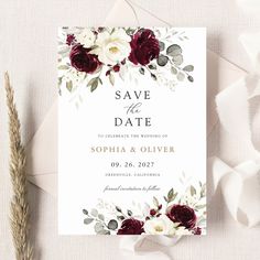 wedding save the date card with burgundy flowers and greenery