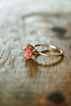 Unique raw Ruby ring in 14K yellow gold fill. My bestselling lotus ring design, now in yellow gold or fill! A handcrafted 14K gold fill band with my etched cup filled with raw Ruby chips in a mosaic pattern, my signature design. Organic, natural ruby reds in varying shades look pretty and unique next to the yellow gold color. Ruby is July's birthstone. Made to order, to size. Scroll to read all the details. I love this ring as sparkly, any occasion present for her, Women's July birthstone gift f Delicate Gold Flower Ring With Gemstone, Gold Flower-shaped Rings With Gemstones, Unique 14k Gold Ruby Ring For Wedding, Yellow Gold Flower Ring With Gemstone For Weddings, Nature-inspired Wedding Rings With Birth Flower, Gold Flower Ring With Birthstone For Wedding, Flower Shaped Ruby Ring In Yellow Gold For Wedding, Untreated Gold Rings For Wedding, Flower-shaped Yellow Gold Ruby Ring For Wedding