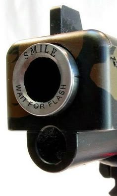 a small camera with a smile on it's lens