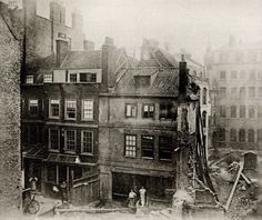 an old black and white photo of some buildings