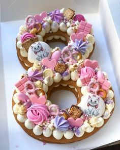 there are two donuts decorated to look like animals and other things on the doughnut