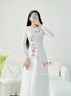 🌻Material: Lụa vân gỗ Stretchy level: 3/10 🌻 The measurement of this ao dai (long dress) is in Vietnamese size (American size tends to be bigger for the same size). Please LOOK AT THE SIZE CHART CAREFULLY BEFORE ORDERING. There might have some chalk writings on the fabric due to making process. These marks can be washed away easily. 🌻🌻No returns or exchanges Buyer can contact seller about any issues with an order. 💜 Thank you very much!💜 Traditional White Ao Dai With Floral Embroidery, Traditional White Embroidered Ao Dai, Traditional White Cheongsam For Spring, Traditional Embroidered Cheongsam For Spring, Traditional Embroidered Spring Cheongsam, Spring White Ao Dai With Floral Embroidery, Spring Wedding Embroidered Ao Dai, Spring Wedding Ao Dai With Floral Print, White Embroidered Ao Dai For Spring