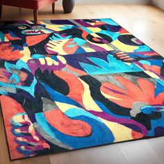 a colorful area rug with an abstract design