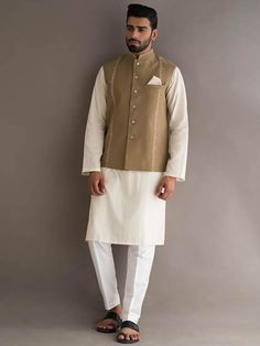 Waistcoat Color: Pale Brown  Waistcoat Fabric: PC Suiting Fabric  Smart looking designer waistcoat features delicate embroidery accent the collar and front  Fancy button closure  Complement with pale aqua kurta and white pajama    Additional Accessories:Peshawari Sandal / Khussa: US$50 Elegant Cotton Nehru Jacket For Spring, Formal Embroidered Cotton Nehru Jacket, Embroidered Cotton Nehru Jacket For Formal Occasions, Festive Beige Nehru Jacket With Long Sleeves, Festive Long Sleeve Beige Nehru Jacket, Festive Beige Long Sleeve Nehru Jacket, Elegant Cotton Nehru Jacket For Semi-formal Occasions, Elegant Semi-formal Cotton Nehru Jacket, Beige Long Sleeve Nehru Jacket With Dabka