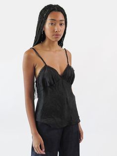 Bias-cut and seamed camisole in our petal silk with black french lace trim and double interlocking spaghetti straps. Our Gilda camisole is cut for a relaxed, flattering fit. Layer with blazers, knits, and dresses and let the lace-trimmed v neckline subtly peek out from underneath. Our signature Petal Silk is hand washed and line dried in our studio, giving our slips and camisoles that soft, relaxed feel of an heirloom piece. Our Petal Silk is a weightless fabric that travels with you easily. Twi Erica Tanov, Black French, Black Camisole, Silk Camisole, Silk Slip Dress, Silk Slip, And Dresses, French Lace, Feminine Style