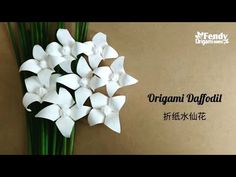 there is a bouquet of white flowers on the wall with words written in english and chinese