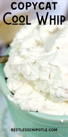 a bowl filled with whipped cream sitting on top of a table