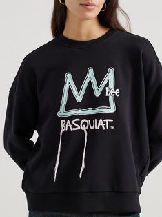 Whether it's a crown of thorns or a statement about his status in the art world, there's no denying that Jean-Michel Basquiat's crown is iconic. Featured on the front of the Women's Lee® x Basquiat™ Logo Sweatshirt, the crown is featured front-and-center along with threads depicting dripping paint as a homage to the artist's start as a graffiti artist. Made with a soft cotton blend with a split seam up the back, this sweatshirt brings a feminine and understated feel to the works of art you know and love. Jean Michel Basquiat Crown, Dripping Paint, Jean Michel Basquiat, Crown Of Thorns, Jean Michel, Drip Painting, Logo Sweatshirt, Graffiti Artist, The Works