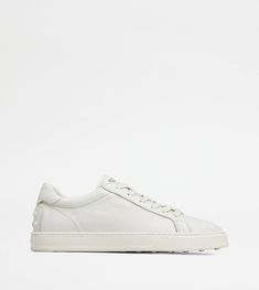 A sober and sophisticated taste characterizes these sneakers with minimal lines, Tod's logo on the tongue. Crafted in soft calfskin leather, they come with a rubber outsole with embossed rubber pebbles. White Sneakers, Calf Skin, Online Shop, Online Store, Sneakers, Leather