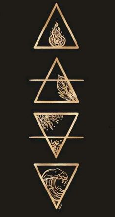 three gold triangles with different shapes and designs on them