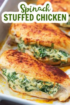 chicken stuffed with spinach and cheese in a baking dish on a white platter